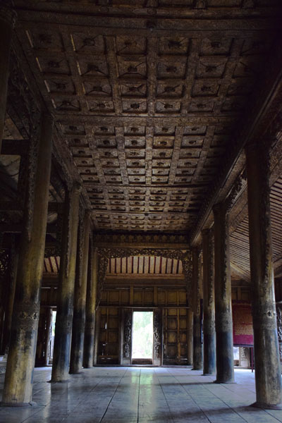 Teak pillars of Golden Palace Monastery Mandalay Myanmar